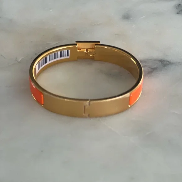 Hermès Clic-Clac Enamel Bracelet in Orange & Gold – Brand  display picture 1